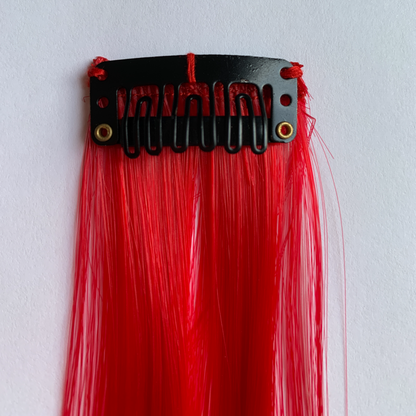 Clip in red hair extensions